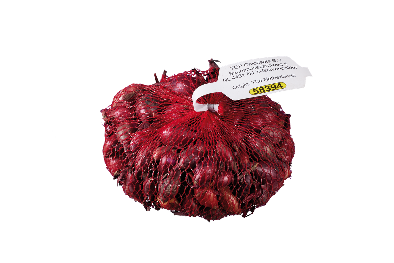 Red onion bulbs in a mesh bag with a label showing origin and product number 58394.