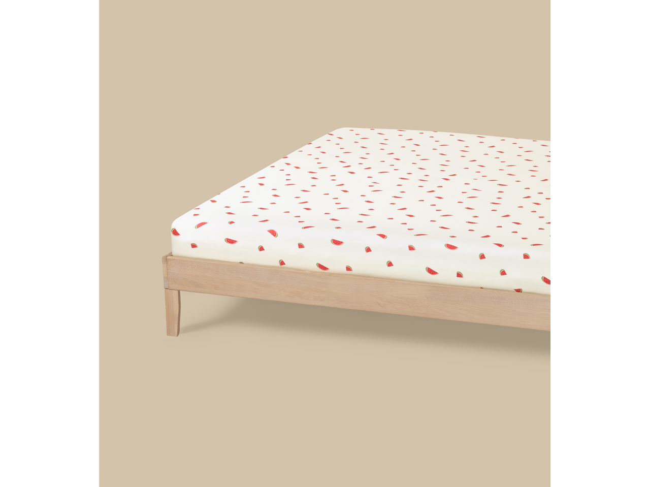 Livarno Jersey Fitted Sheet with a watermelon pattern on a wooden bed frame