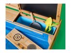 Wooden mud kitchen with a blue basin, a chalkboard, and play gardening tools.