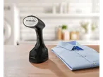 Vaporizador de mão Silvercrest® e camisa azul dobrada sobre uma mesa de madeira.