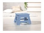 A light blue plastic folding step stool sits on a light wood floor.