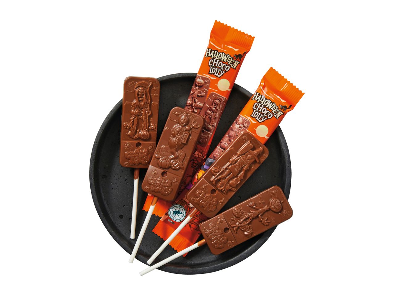Halloween chocolate lollipops with spooky designs on a black plate.