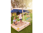 Children playing in a LUPILU sandbox with blue sunshade and sand toys.