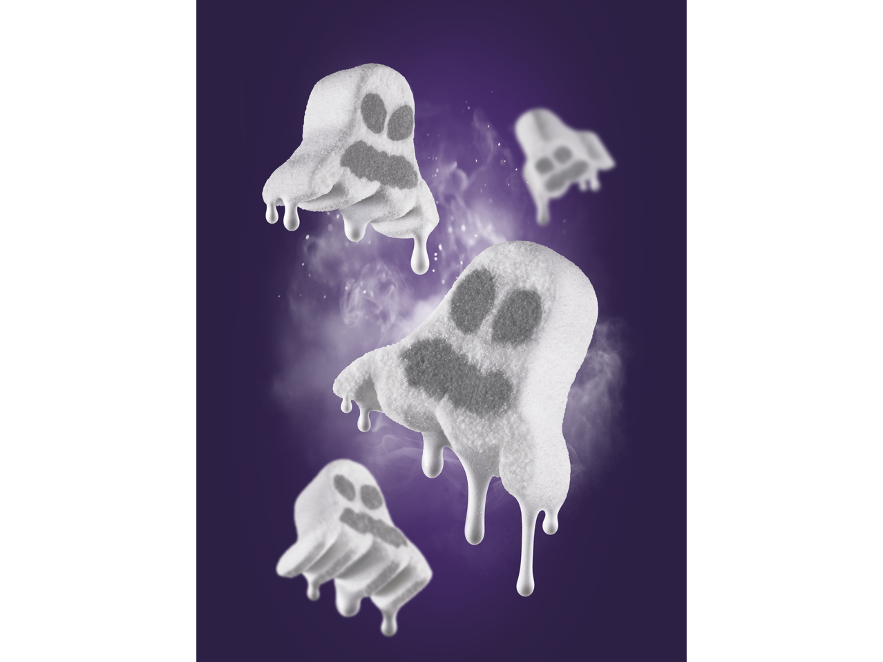 White ghost-shaped marshmallows with melting drips on a purple background.