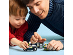 Father and son playing with police and robber building toys