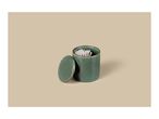 Green ceramic container with lid and cotton swabs on a beige background.