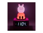 Pink pig-shaped night light and alarm clock displaying 1:04 PM.