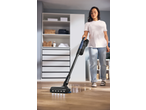 Woman cleaning a wooden floor with a SILVERCREST® Cordless Cyclone Handheld Vacuum Cleaner.