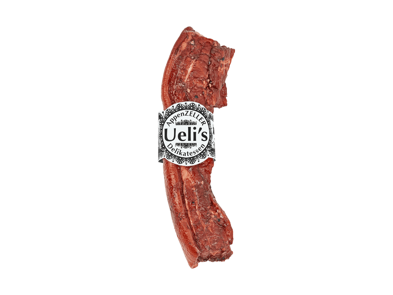 Viande fumée avec ail, thym et épices sur une planche en ardoise.