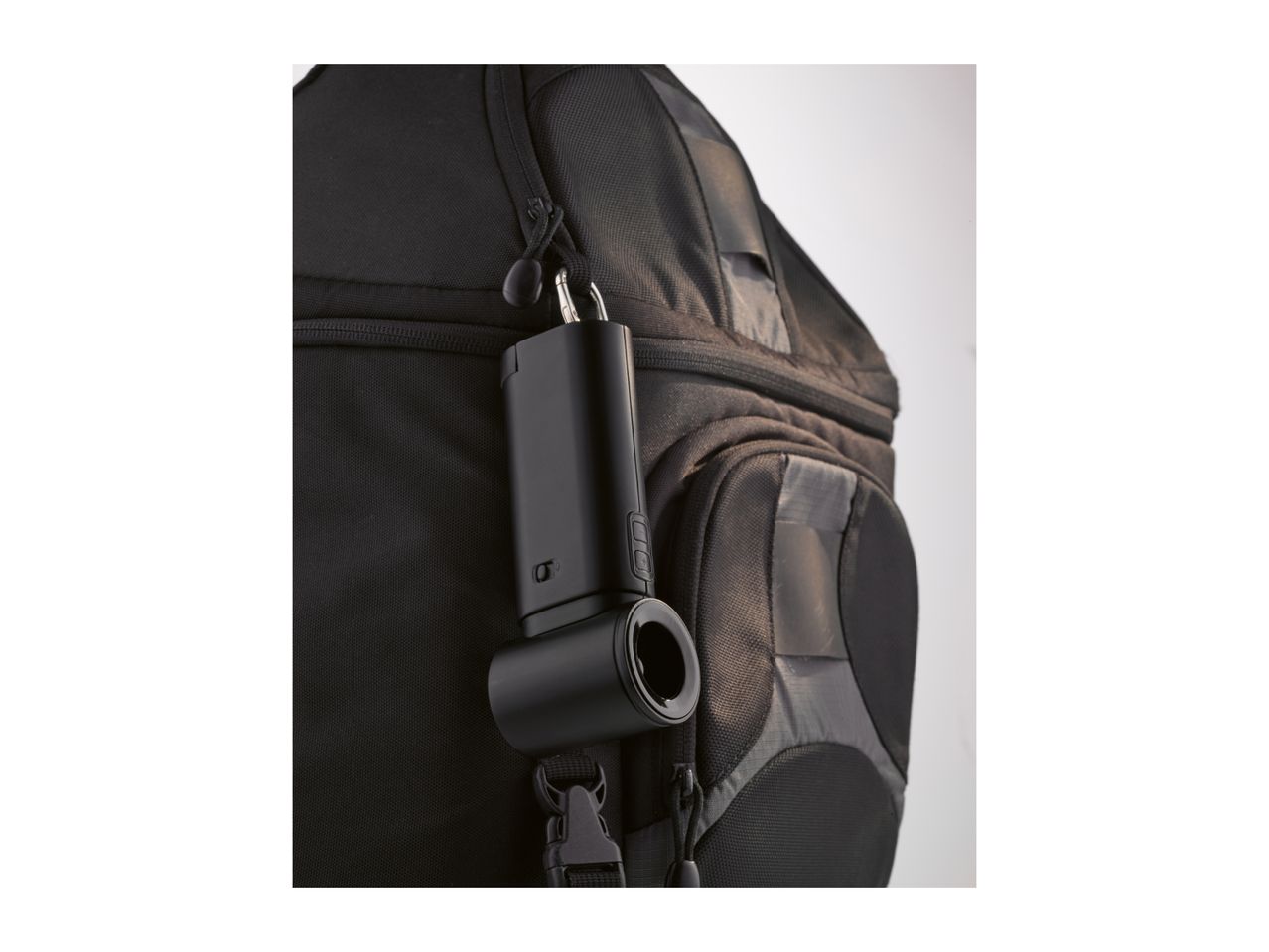 Black portable fan attached to a black backpack