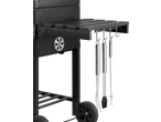 Grillmeister Charcoal Barbecue with side shelf and hanging barbecue tools.