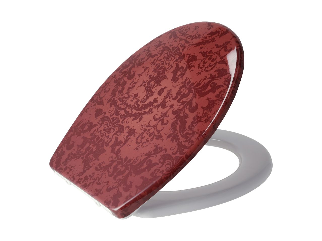 Rødt toiletsæde med et mønster af damask og hvide beslag.