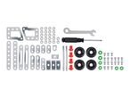 A set of metal construction toy parts, including beams, wheels, screws, and tools.