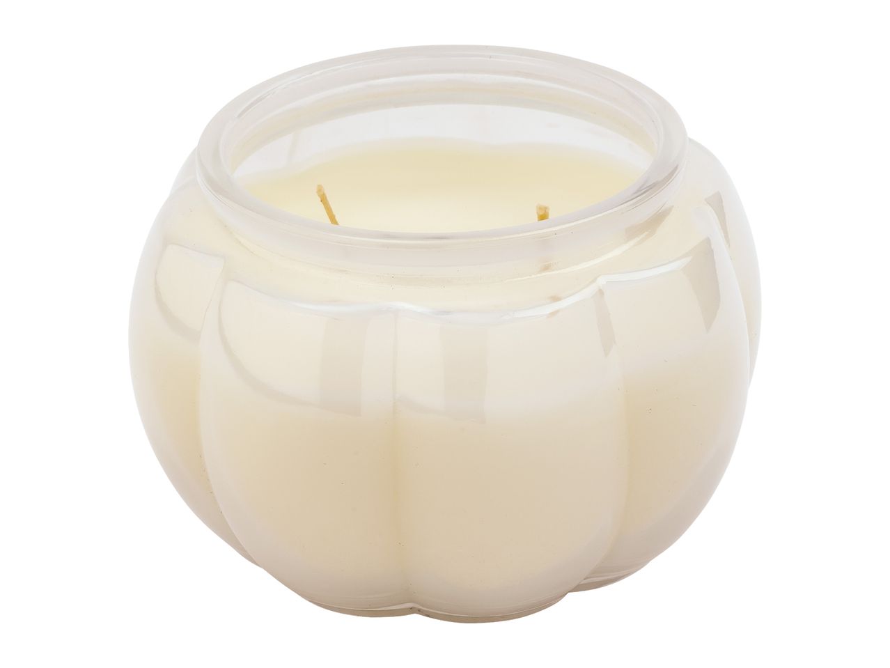 Pumpkin-shaped glass jar candle with two wicks and light-colored wax.