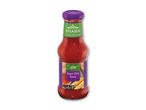 Flaske med sød chilisauce i thailandsk stil, mærket som medium styrke og indeholdende 250 ml.