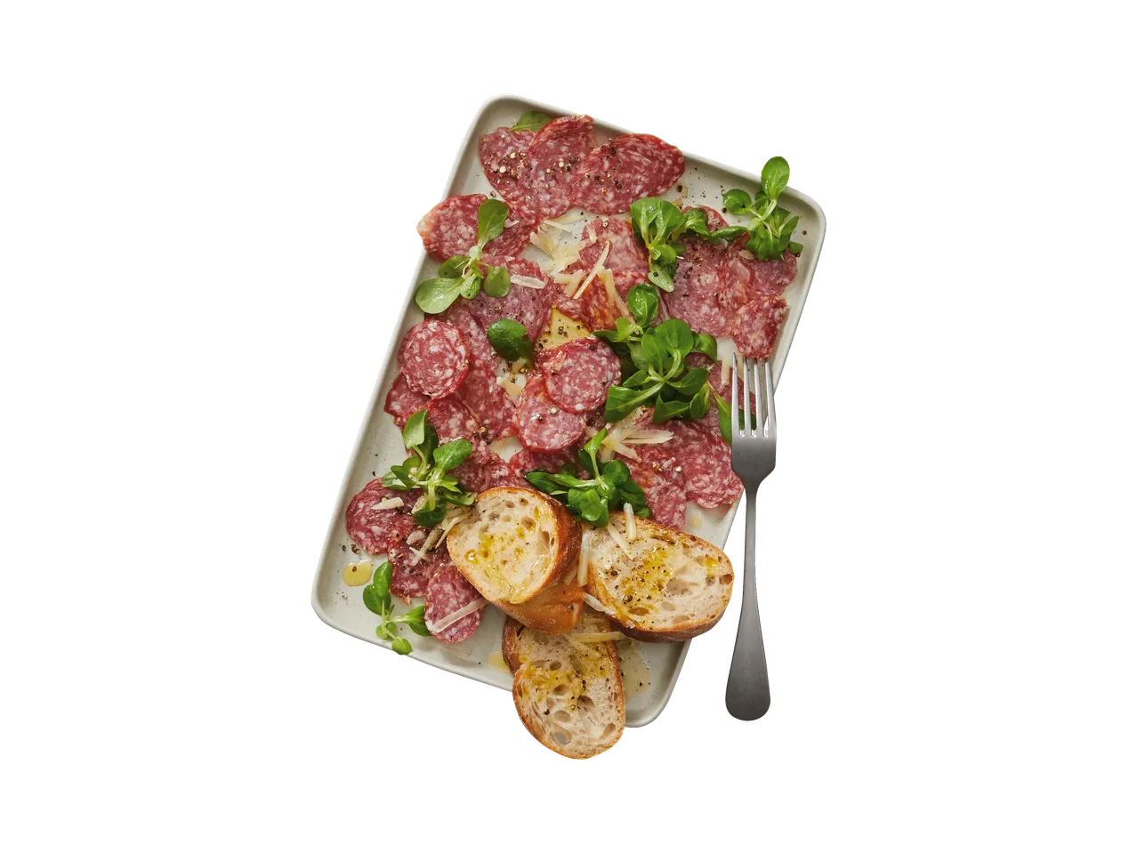 Italiamo Strolghino Pork Salami with bread, cheese, and greens on a platter