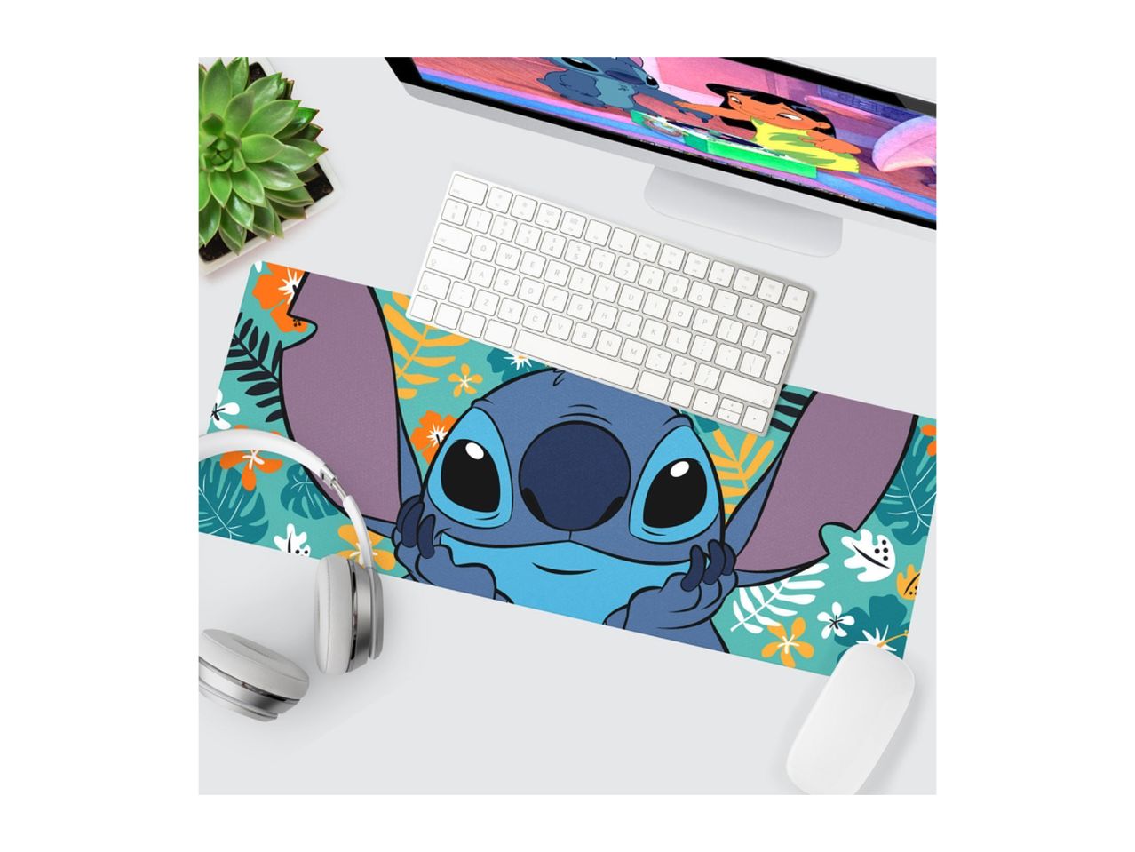 Stitch-themed desk mat with a computer, keyboard, mouse, headphones, and plant.