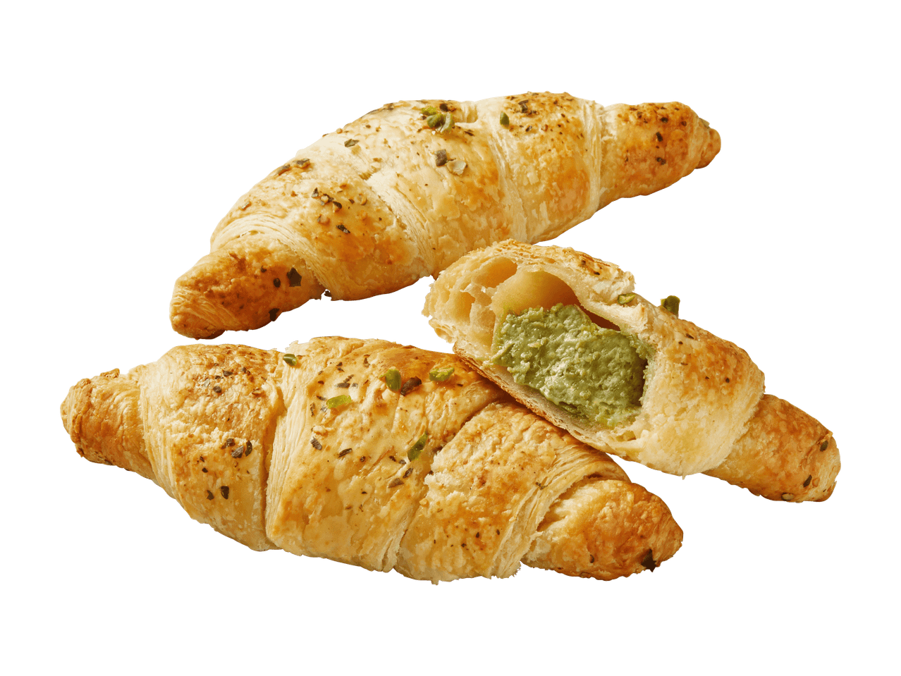 Tre croissant, uno tagliato a metà con ripieno verde al pistacchio.