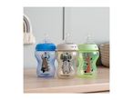 Three Tommee Tippee baby bottles with animal designs on a wooden surface.