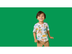 Lupilu Kids' T-Shirt with a smiling boy wearing a white dinosaur print tee and brown shorts.