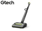 A modern grey and green cordless upright vacuum cleaner.