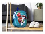 Children's backpack with cartoon dinosaur and dog characters, next to white sneakers on a wooden shelf.