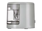 A gray electric pencil sharpener with a clear plastic shavings container.