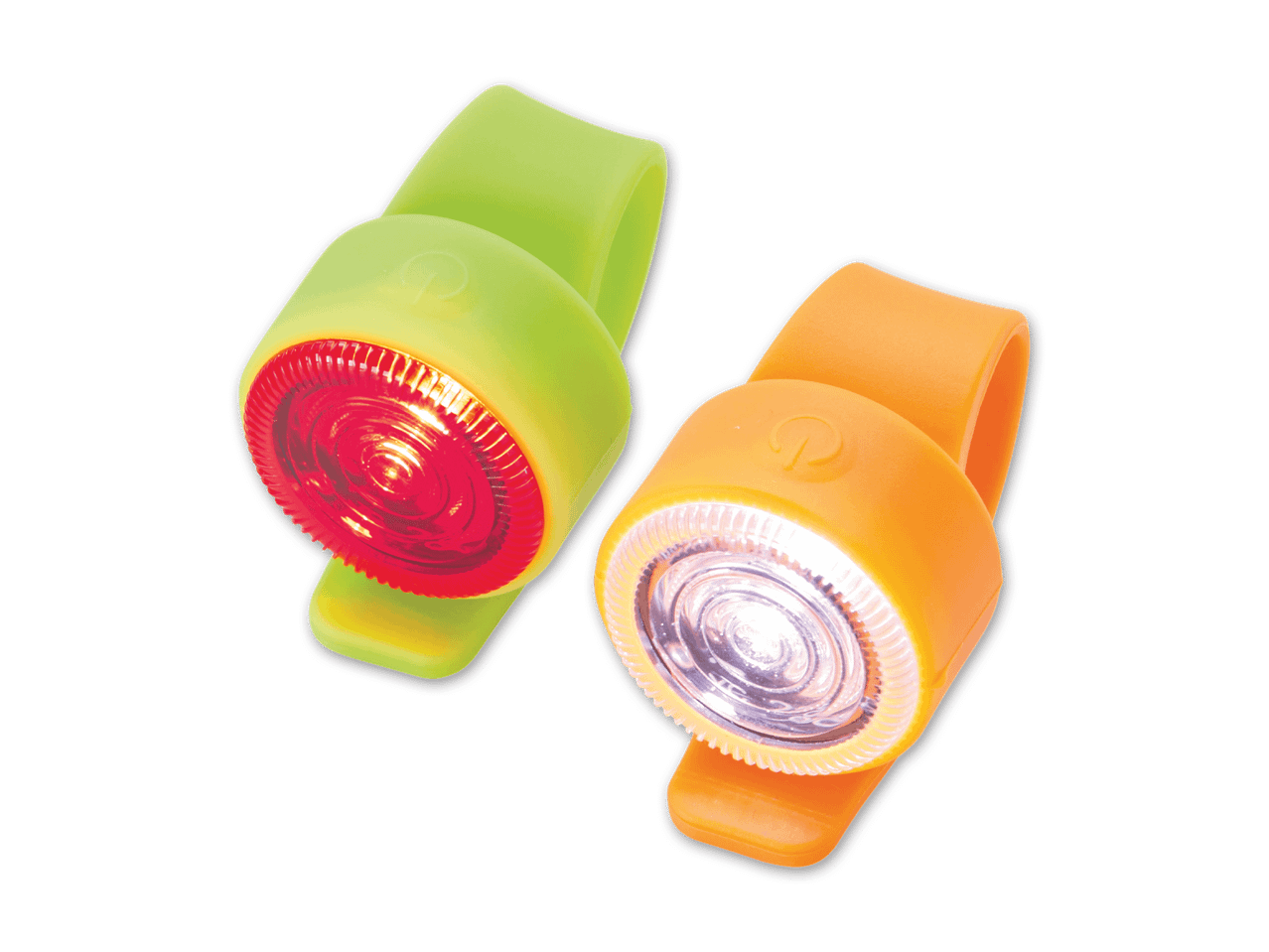 Zwei leuchtende Fahrradlichter, eines rot und eines weiß, auf schwarzem Hintergrund.