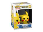 Pikachu vinyl figure in a box, with warnings and product details.