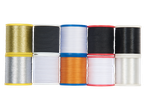 Spools of sewing thread: gold, black, white and orange.