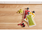 Fruit purees in pouches: green, red, and yellow.