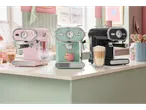 Three SilverCrest espresso machines on a kitchen counter: pink, mint green, and black.