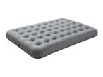 Grey inflatable air mattress with a textured surface, viewed from an angle.
