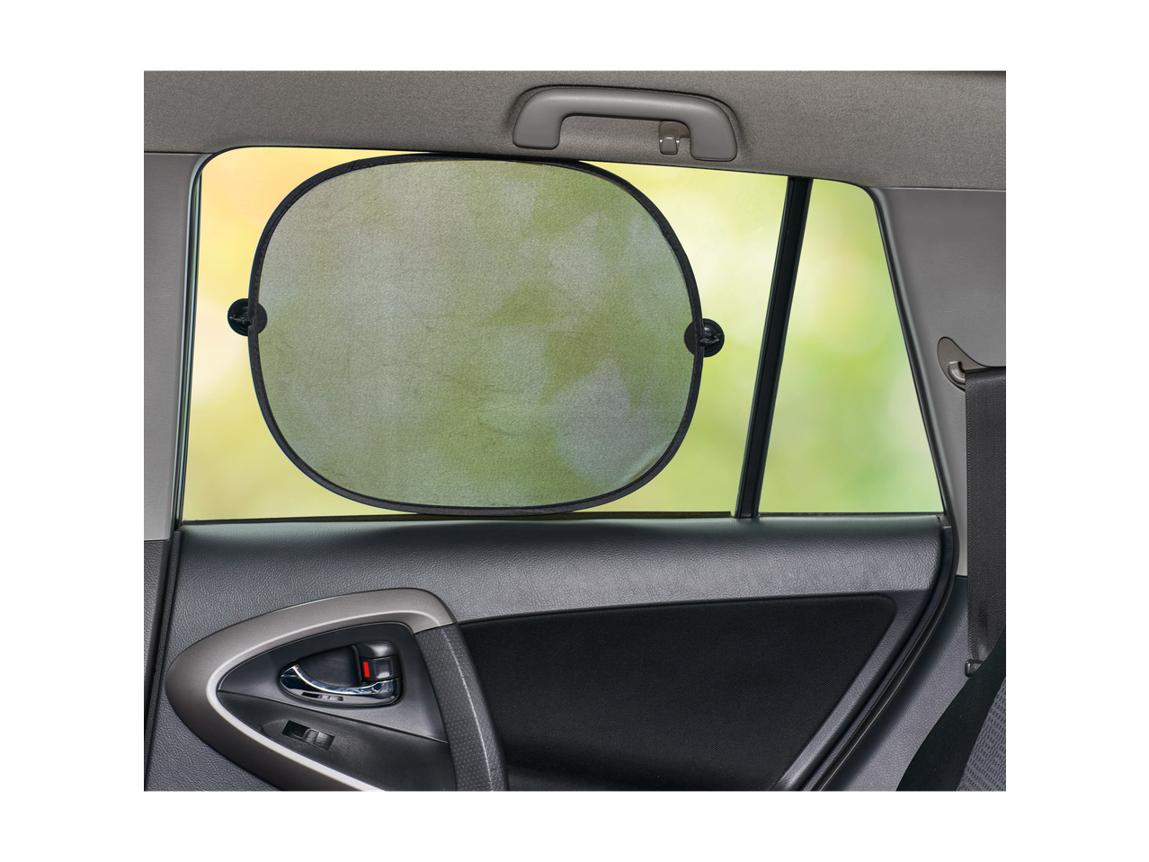 Car window sun shade attached to a car window, seen from inside the car.