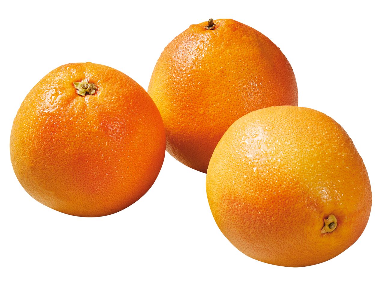 Drei saftige Grapefruits.