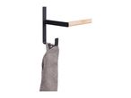 Black metal towel rail with a bamboo bar and a grey towel hanging from a hook.