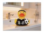 Rubber duck in a football jersey holding a soccer ball, on a bathroom counter.