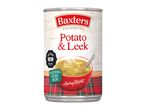 Can of potato and leek soup with a red bowl of soup and a tartan pattern.