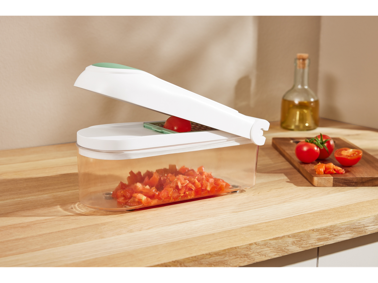 Vegetable chopper with diced tomatoes.