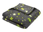 A folded gray blanket with glow-in-the-dark green stars.