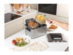 A Salter deep fat fryer with fries and chicken, alongside spring rolls and onion rings.