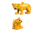 Two yellow toy lions, one adult and one cub, standing on a white background.