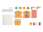 Gingerbread house craft kit with house pieces, roof, base, decorative elements, and gingerbread figures.