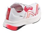 White and red running shoe with a textured sole and a red heel strap.