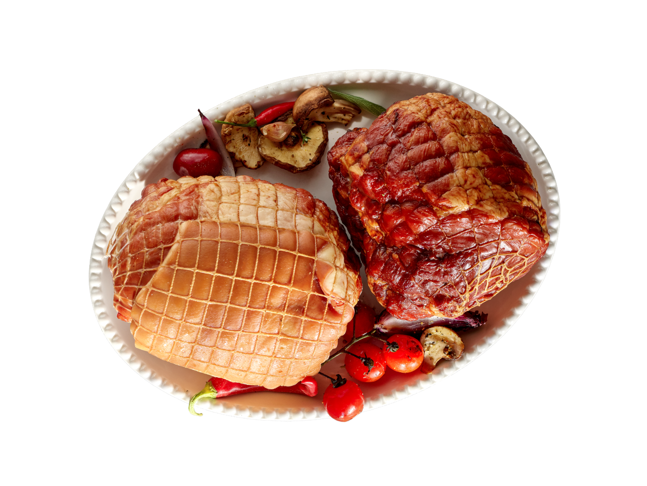 Dva komada pečenog mesa s povrćem na bijelom pladnju.