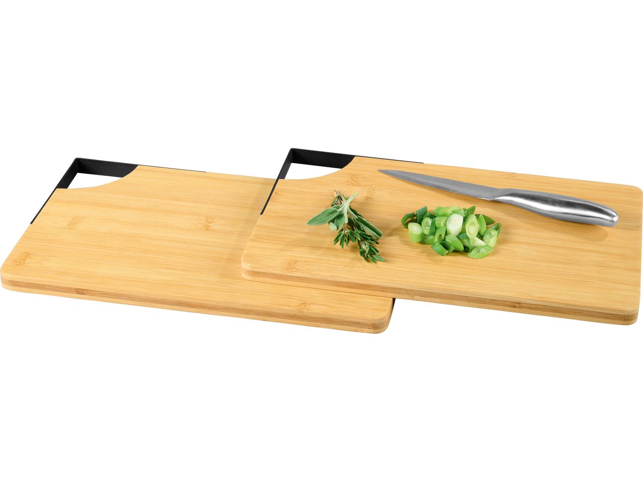 Two bamboo cutting boards, one with a knife, herbs, and chopped green onions.
