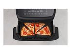Air fryer with a digital display, containing four slices of pepperoni pizza.