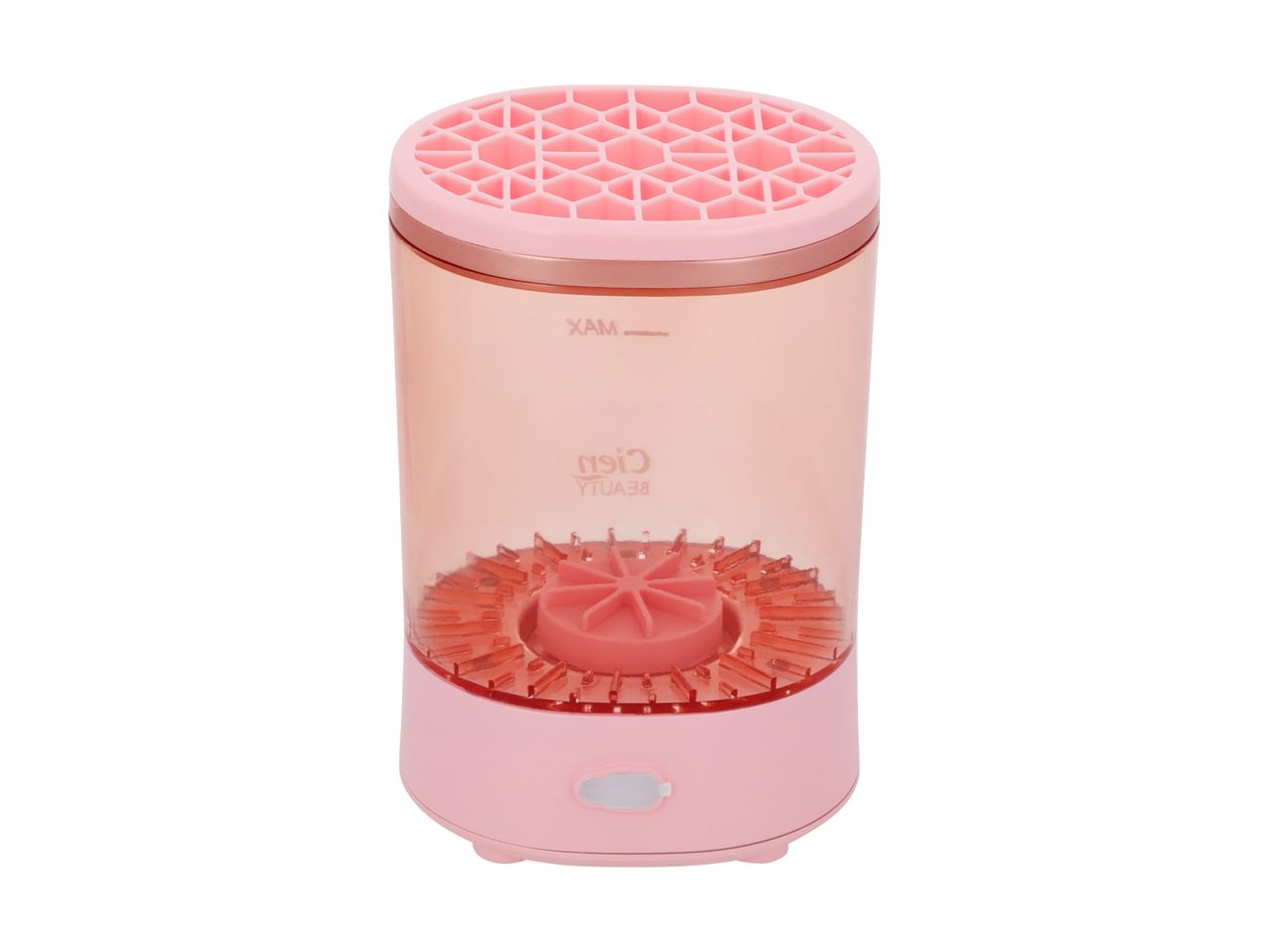 Pink makeup brush cleaner with a clear cylindrical body and a honeycomb-patterned top.