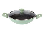 Light green wok pan with a speckled non-stick interior and a glass lid