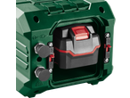 Green portable power station with a black and red battery pack inserted, showing charging ports.